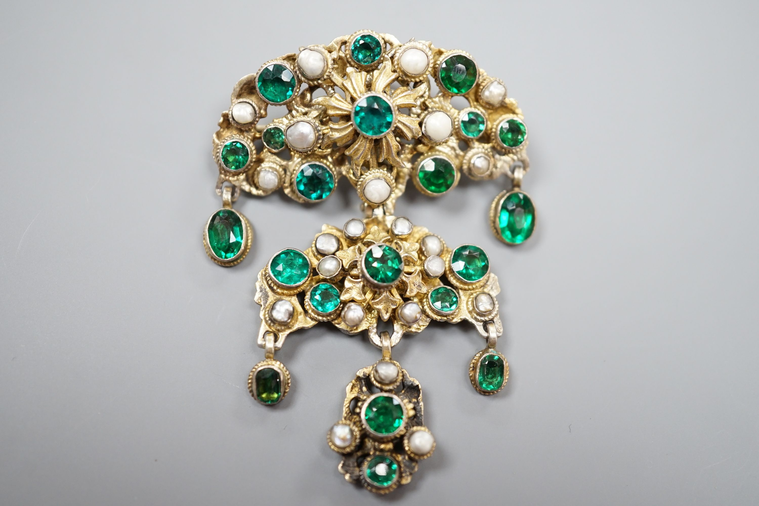 An Austro Hungarian gilt white metal, baroque pearl and green paste set drop pendant brooch, 59mm.